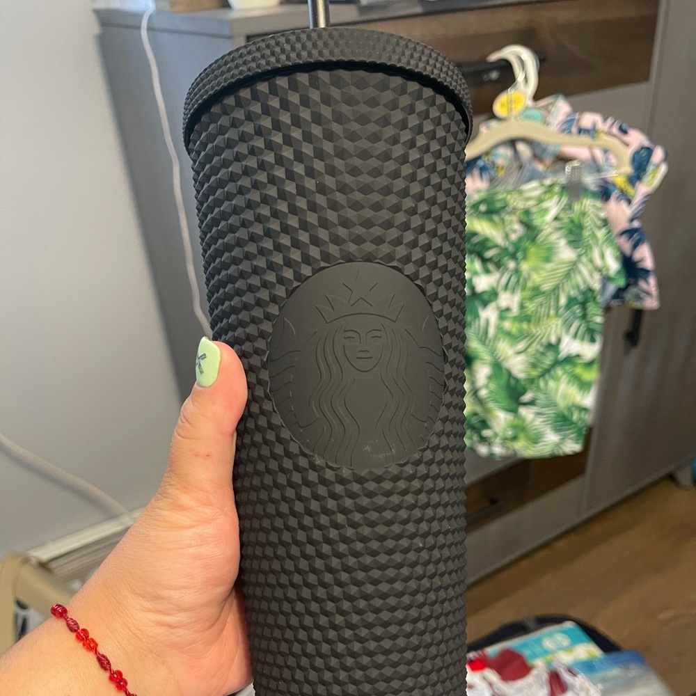 Black studded Starbucks venti cup.